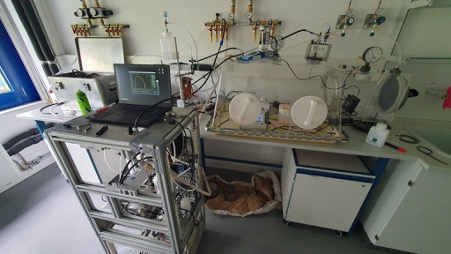 A laptop, air quality sensors and other lab equipment at the TROPOS offices. 