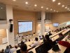  Participants seated in a tiered lecture hall during the EDIAQI Indoor Air Quality Conference in Zagreb.